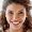 Closeup portrait of a smiling young businesswoman standing in an office.