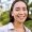 Close up face of asian happy girl, smiling and looking at camera carefree, walking in park.